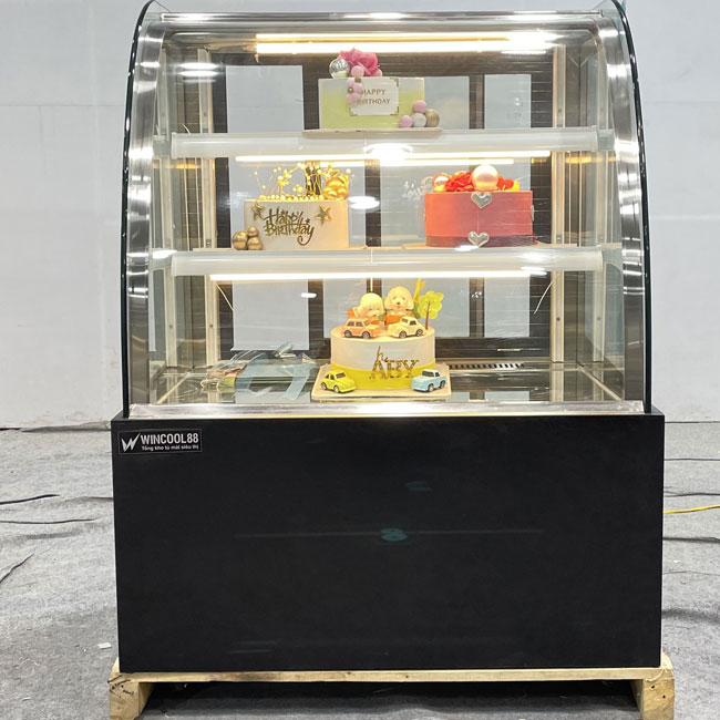 Tủ bánh kem kệ vàng 90cm kính cong 3 tầng màu đen chính diện